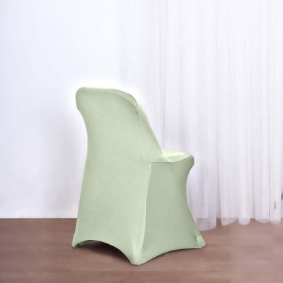 Green fabric chair displayed against a plain backdrop.