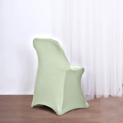 Green chair cover on a chair against a light backdrop.