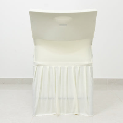 White folding chair with a draped skirt
