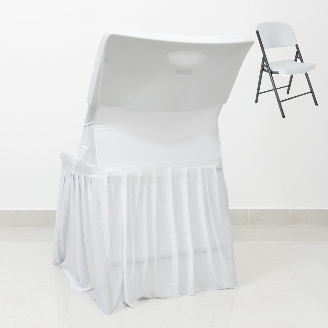 Folding chair with white cover on a plain background
