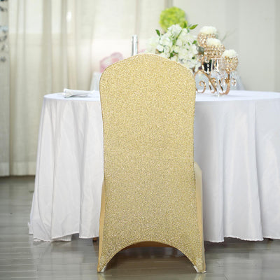 Gold sequin chair cover against a white table setting