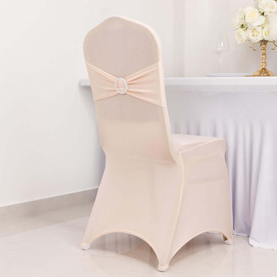 Elegant chair cover with bow detail, perfect for events or weddings.