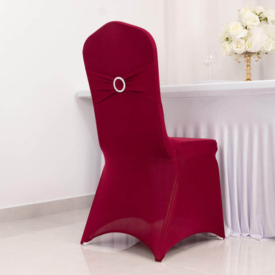 Red chair cover with bow detail, styled for an elegant dining setup.