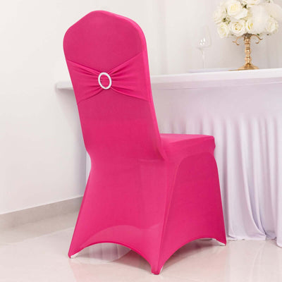 Pink chair cover with bow detail on a dining chair.