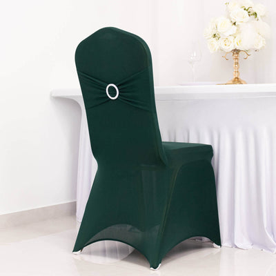 Green chair cover with rhinestone embellishment on a dining chair.