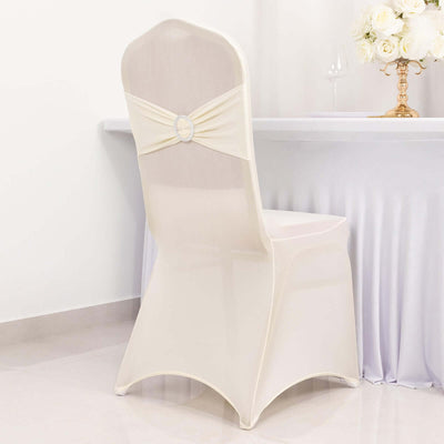 Elegant cream chair cover with decorative bow for events or weddings.