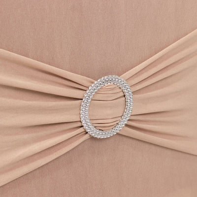 Elegant beige dress detail with sparkling rhinestone embellishment.