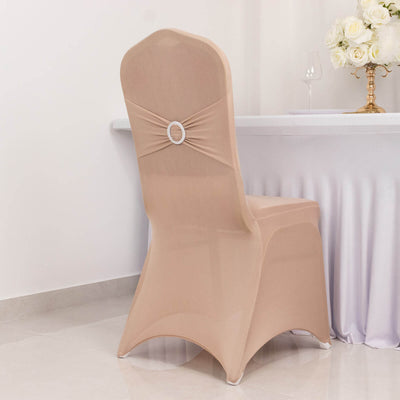 Beige chair cover with decorative ring, ideal for events or weddings.