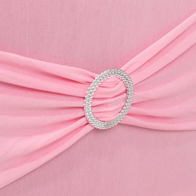 Pink dress with a sparkling circular belt detail.