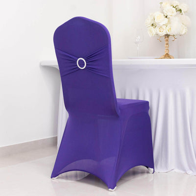 Purple chair cover with decorative ring, styled for events.