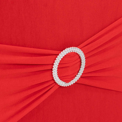 Red dress detail with embellished belt buckle.
