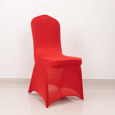 Red stretch chair cover on a plain backdrop