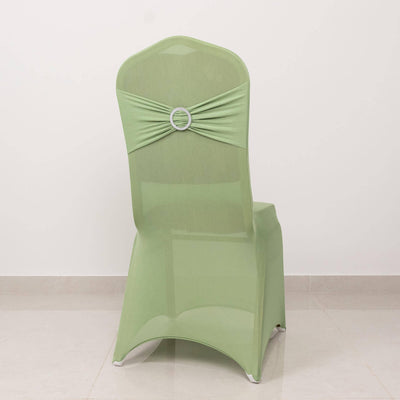 Green chair cover with decorative back detail on a plain background.