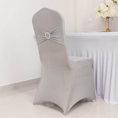 Elegant gray chair cover with decorative bow for event styling.