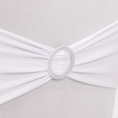 White fabric draped with a sparkling silver ring detail