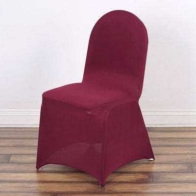 Burgundy chair cover on a plain backdrop for event decor