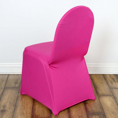 Pink chair cover on a chair against a plain background.
