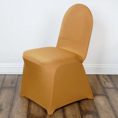 Gold chair cover on a chair with a smooth design against a plain background.