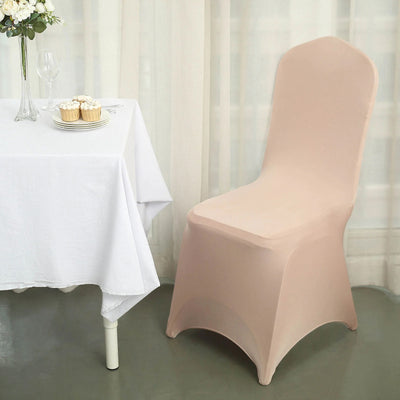 Elegant beige chair cover draped over a chair at a table with cupcakes.
