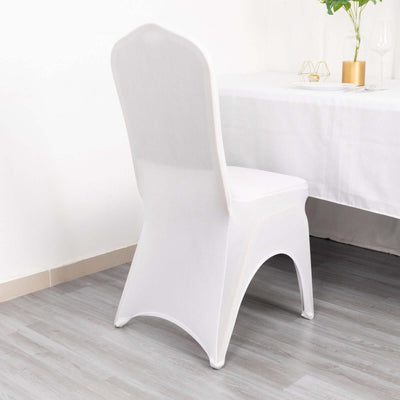White chair with sleek design against a plain backdrop.
