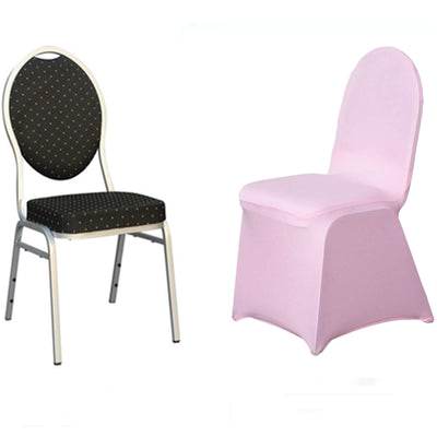 Black and gold polka dot chair next to pink slipcovered chair