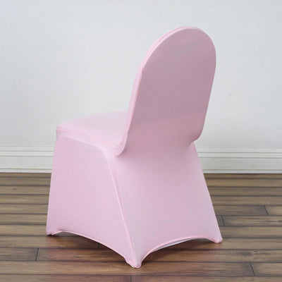 Pink plastic chair viewed from the back against a plain background
