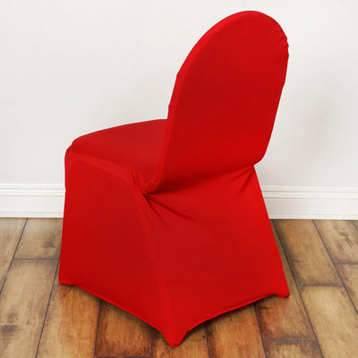 Red stretch chair cover on a wooden floor.
