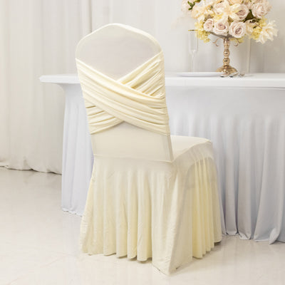 Cream chair cover with draped design, elegantly styled for events.