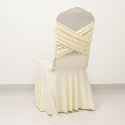 Elegant ivory chair cover with draped design, perfect for events.