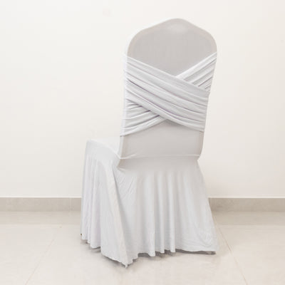 Elegant white chair cover with draped design, perfect for events or weddings.