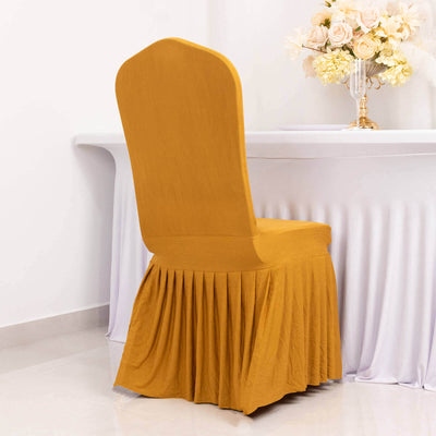 Orange pleated chair cover on a white table in a bright setting.