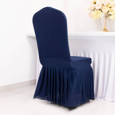 Navy blue chair cover with pleats for elegant dining setup.