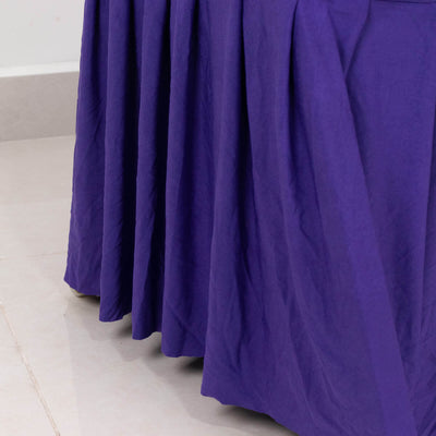 Purple table skirt draping elegantly on a smooth surface.