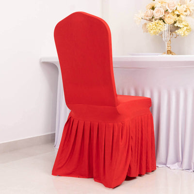 Red chair cover with pleated skirt on a white table setting.