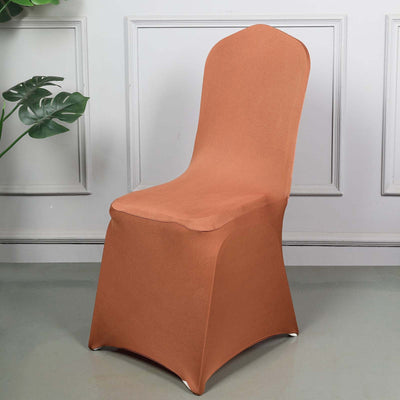 Brown stretch chair cover on a dining chair in a stylish interior setting.