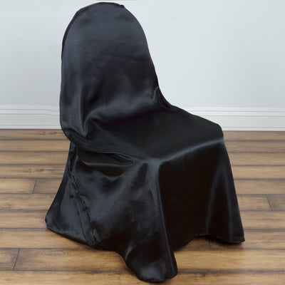 Black satin chair cover on a wooden floor.