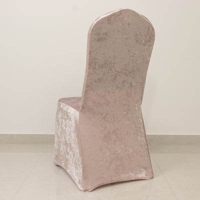 Velvet chair cover in soft pink with a smooth finish.