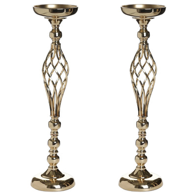 Gold decorative candle holders with an elegant twisted design #whtbkgd