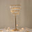 Decorative test tube stand with fairy lights on a table setting.