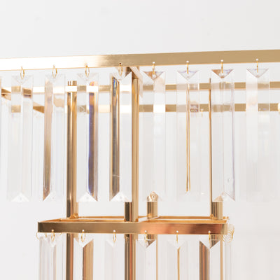 Elegant gold and crystal chandelier with hanging prisms