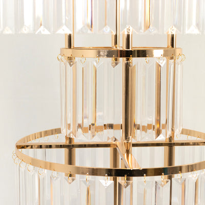 Elegant crystal chandelier with gold accents and geometric design.
