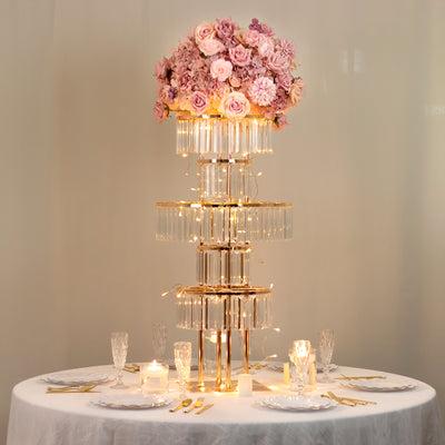 Elegant floral centerpiece with lights on a table setting for special occasions.