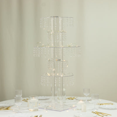 Crystal tower cake stand with hanging beads and fairy lights.