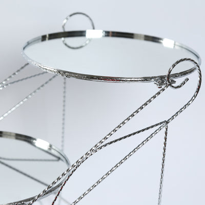 Two-tier mirrored serving stand with decorative metalwork