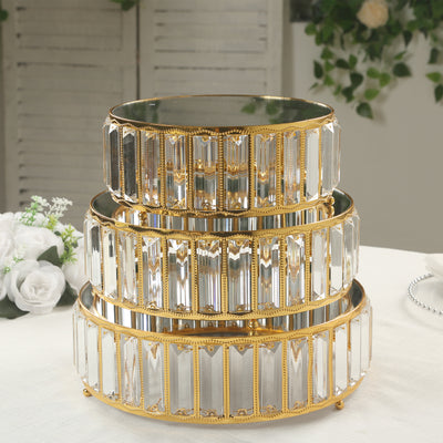 Elegant gold and crystal three-tier serving stand for special occasions.