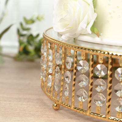 Elegant gold cake stand with crystal accents and floral decoration.