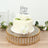 Elegant birthday cake with white roses and a silver "Happy Birthday" topper.