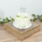White birthday cake adorned with roses on a decorative mirror tray.