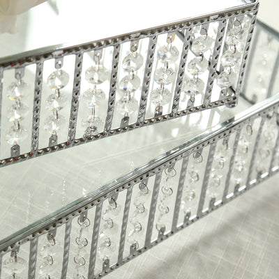 Elegant mirrored tray with crystal accents and decorative metal design.