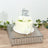 White cake with floral decoration and "Happy Birthday" topper on a decorative tray.